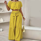 Zweiteiliges Set aus Off-Shoulder-Oberteil mit Puffärmeln und weiten Hosen – Elegant, bequem und perfekt für Sommertage ☀️
