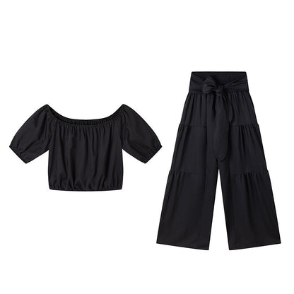 Zweiteiliges Set aus Off-Shoulder-Oberteil mit Puffärmeln und weiten Hosen – Elegant, bequem und perfekt für Sommertage ☀️