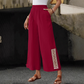 Damenhose mit elastischem Bund, weitem Bein und Quasten